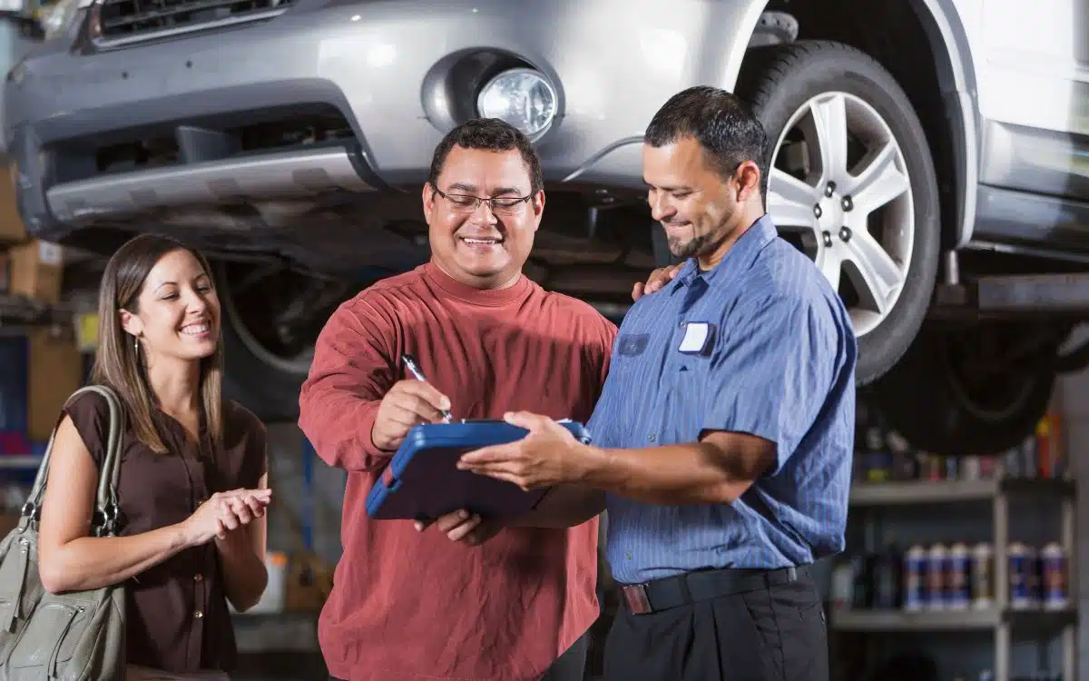 Couple at auto repair shop - West Delray Collission Center Couple at auto repair shop - West Delray Collission Center