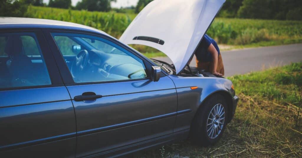 Collision repair shop with vehicles, lift systems, and equipment used for aluminum auto body repair
